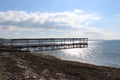 Sea calm skies and docks Royalty Free Stock Photo