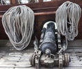 The sea cannon. The old ship cannon, the ropes at the side of the ship. A pirate ship. Royalty Free Stock Photo