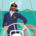 Sea captain on the deck with ships steering wheel