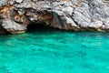 Sea cave with blue water at daytime Royalty Free Stock Photo