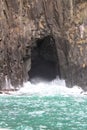 Sea Cave in rocks with a blast of water off the Coast of Bruny Island Tasmania Australia Royalty Free Stock Photo