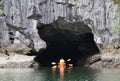 Sea cave and kayakers