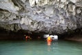 Sea cave and kayakers