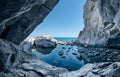 Sea cave rocks. Grotto with water reflections