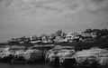 Sea Caves, Rocky Coast with a city above