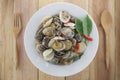 sea clams or RIDGED VENUS of Stir sauce in white dish. Royalty Free Stock Photo