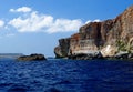 Sea and cliffs of Gozo island in Malta in bright day Royalty Free Stock Photo