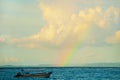 Sea, clouds, boat, rainbow. Nusa Dua Bali. Geger Beach. Indonesia. Royalty Free Stock Photo