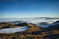 sea of clouds on mountain peak with snow field Royalty Free Stock Photo