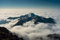 Sea of clouds under huge mountain Royalty Free Stock Photo