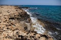 Sea coast on the background of a stone shore with a rising wave Royalty Free Stock Photo