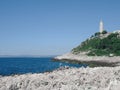 Sea coast big white stones in france lighthouse on a mountain i Royalty Free Stock Photo