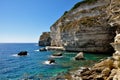 A sea coast in Corsica, Corse, France Europe with cliffs and path in the rocks Royalty Free Stock Photo