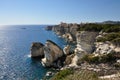 A sea coast in Corsica, Corse, France Europe with cliffs and small town Royalty Free Stock Photo
