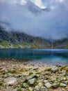 Sea coast landscape with cloudy sky. Mountain river. A view of a coral hill on the edge of a vast sea, waves, against a cloudy Royalty Free Stock Photo