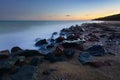 Sea coast with stones at sea shore.