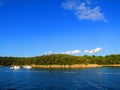 Sea and coast in Suha Punta Rab Island Croatia with clouds Sky Sea and boats Royalty Free Stock Photo