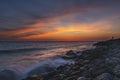 The sea coast at sunset with beautiful clouds Royalty Free Stock Photo