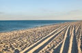 Sea coast. Wheel ruts on the sand Royalty Free Stock Photo