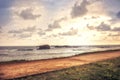 Sea coastline surf waves scenery at sunset with dramatic sunset sky vintage style in Sri Lanka Galle