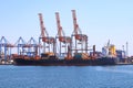 Sea container ship loading at the container terminal in the Odessa seaport. Ships, transport in sea port. Odesa, Ukraine