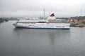 A sea cruise ferry `Viking Cinderella` takes place in the harbor of Stockholm on a foggy August day. Sweden Royalty Free Stock Photo