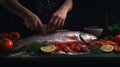 Sea cuisine, Professional cook prepares pieces of red fish, salmon, trout with vegetables.Cooking seafood, healthy vegetarian food