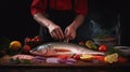 Sea cuisine, Professional cook prepares pieces of red fish, salmon, trout with vegetables.Cooking seafood, healthy vegetarian food