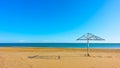 Sea and emply sandy beach with paraso Royalty Free Stock Photo