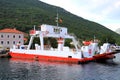 Sea ferry stands in Bay of Kotor, water transport, boat, ship, catamaran in spring, summer. Bay of Kotor, Montenegro
