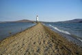 In the sea filled the road to the lighthouse, in the middle of the Sea Beach line passes