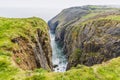 The sea fills an isolated cove on the Pembrokeshire coast neart to Tenby, South Wales