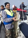 Sea fisherman with huge cod Royalty Free Stock Photo