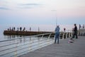 Sea fishing from the pier. Evening, Odessa City, Ukraine, June 2019 Royalty Free Stock Photo