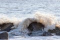 Sea flood defence. Waves crashing on rocks. Coastal erosion