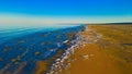 Sea foam at the beach of the Aral Sea near Aktumsuk cape at sunset, Karakalpakstan, Uzbekistan