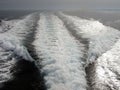 Sea foam waves in perspective behind a ship or boat Royalty Free Stock Photo