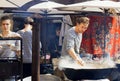 Sea-food cook preparing food in huge pan at outdoor party