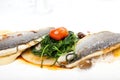 Sea food with fillet of sea bass on white background