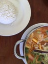 Sea food tom yum in pot with rice