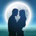 Sea with full moon and silhouette couple at night. Royalty Free Stock Photo