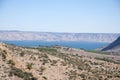 Sea of Galilee with Arbel cliff Royalty Free Stock Photo