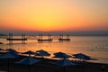 Sunrise over the Sea of Galilee beachfront with people swimming, in Israel. Royalty Free Stock Photo