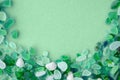 sea glass pieces on mint background Royalty Free Stock Photo