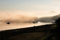 Magic light with fishing boats - Morning fog above the surface of the Glacier Bay - Alaska Royalty Free Stock Photo