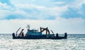 Sea going dredging barge digging out the seafloor Royalty Free Stock Photo