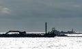 Sea going dredging barge digging out the seafloor Royalty Free Stock Photo