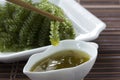 Sea grapes or green caviar and spicy sauce on a white dish Royalty Free Stock Photo