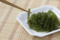 Sea grapes or green caviar and spicy sauce on a white dish the w Royalty Free Stock Photo