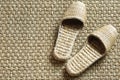 Sea-grass slippers on woven carpet Royalty Free Stock Photo